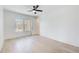 Well-lit bedroom with hardwood floors, ceiling fan, and large windows that provide ample natural light at 555 Lower Birmingham Rd, Canton, GA 30115