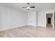 Bedroom featuring neutral walls, light wood floors, and a modern ceiling fan at 555 Lower Birmingham Rd, Canton, GA 30115
