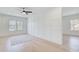 Bright bedroom with stylish feature wall, ceiling fan and light wood flooring at 555 Lower Birmingham Rd, Canton, GA 30115