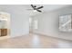 Bright bedroom with light wood flooring, ceiling fan, and an ensuite bathroom at 555 Lower Birmingham Rd, Canton, GA 30115