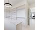 Spacious walk-in closet with custom shelving, drawers, and island at 555 Lower Birmingham Rd, Canton, GA 30115
