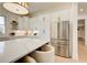 Kitchen with stainless steel refrigerator, a large island, and all-white cabinetry at 555 Lower Birmingham Rd, Canton, GA 30115