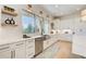 Bright kitchen featuring white cabinets, stainless steel appliances, and quartz countertops at 555 Lower Birmingham Rd, Canton, GA 30115