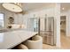 Kitchen featuring stainless steel refrigerator and large island with cabinets open to pantry at 555 Lower Birmingham Rd, Canton, GA 30115