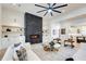 Bright living room with a modern fireplace, ceiling fan, and open layout at 555 Lower Birmingham Rd, Canton, GA 30115