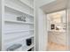 Walk-in pantry with custom shelving and access to kitchen at 555 Lower Birmingham Rd, Canton, GA 30115