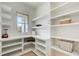 Pantry featuring custom shelving, ample counter space, and a window for natural light at 555 Lower Birmingham Rd, Canton, GA 30115
