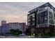 Modern apartment building exterior featuring sleek design, balconies and street view at 567 Ponce De Leon Ne Ave # 506, Atlanta, GA 30308