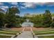 Picturesque view of a Gathering enjoying the serene pond and fountain from a park at 567 Ponce De Leon Ave # 506, Atlanta, GA 30308