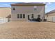 The backyard includes a lawn, patio area with grill, privacy fence, and solar panels on the home at 6028 Providence Dr, Union City, GA 30291