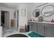 Modern bathroom with dual sinks, gray vanity, and well-lit mirrors at 6028 Providence Dr, Union City, GA 30291