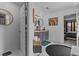 Stylish bathroom with gray vanity, circular mirrors, and decorative floor at 6028 Providence Dr, Union City, GA 30291