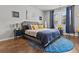 Comfortable primary bedroom with a king bed, wood floors, and neutral tones at 6028 Providence Dr, Union City, GA 30291