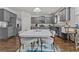 Open-concept dining room with natural light and a large table with modern decor at 6028 Providence Dr, Union City, GA 30291