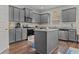 Modern kitchen with gray cabinets, stainless steel appliances, and granite countertops at 6028 Providence Dr, Union City, GA 30291
