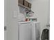 Laundry area with new washer and dryer and storage space at 6028 Providence Dr, Union City, GA 30291