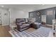 Cozy living room with a large sectional sofa, accent rug, and tasteful decor at 6028 Providence Dr, Union City, GA 30291