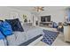 Bright main bedroom with ceiling fan, accent rug, and plenty of natural light at 6028 Providence Dr, Union City, GA 30291