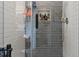 Sleek shower with modern tile, glass door, and built-in shower niche at 6028 Providence Dr, Union City, GA 30291
