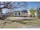 Cozy home featuring backyard with concrete patio and a wooden deck perfect for relaxing outdoors at 1627 Walker Ave, College Park, GA 30337