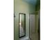 Bathroom features a glass-enclosed shower, vanity, and a wall mirror at 1627 Walker Ave, College Park, GA 30337