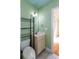 Powder room featuring tile floors, a modern sink, mirror, and shelving for storage at 1627 Walker Ave, College Park, GA 30337