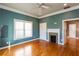 Spacious bedroom with gorgeous hardwood floors and a cozy fireplace at 1627 Walker Ave, College Park, GA 30337