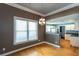Dining area features hardwood floors, bright window, and direct access to the kitchen at 1627 Walker Ave, College Park, GA 30337