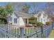 Charming one-story home featuring a welcoming front porch, black fence and well-maintained landscaping at 1627 Walker Ave, College Park, GA 30337
