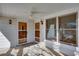 Covered front porch with ceiling fan and lots of natural light at 1627 Walker Ave, College Park, GA 30337