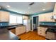Bright kitchen features white cabinets, stainless steel appliances, and a window over the sink at 1627 Walker Ave, College Park, GA 30337