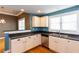 Bright kitchen features stainless steel appliances, white cabinets, and dark countertops at 1627 Walker Ave, College Park, GA 30337