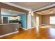 Open-concept living space with hardwood floors, kitchen access, and natural light at 1627 Walker Ave, College Park, GA 30337