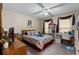 Comfortable bedroom with neutral walls, a ceiling fan, and ample storage with shelving at 2605 Jacobean Rd, Acworth, GA 30101