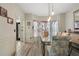 Charming dining room with hardwood floors and a vintage-style glass table with upholstered chairs at 2605 Jacobean Rd, Acworth, GA 30101