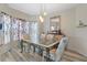 Beautiful dining area with a unique glass table, accent lighting, and bay window at 2605 Jacobean Rd, Acworth, GA 30101