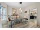 Elegant dining room featuring a glass table, modern lighting, and stylish decor at 2605 Jacobean Rd, Acworth, GA 30101