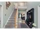 Inviting entryway with a staircase, coat rack, and a glimpse into the cozy living room at 2605 Jacobean Rd, Acworth, GA 30101