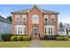 Charming brick two-story home featuring bay windows, manicured landscaping and a welcoming front porch at 2605 Jacobean Rd, Acworth, GA 30101