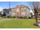 A classic two-story brick house with neat front yard and manicured shrubs at 2605 Jacobean Rd, Acworth, GA 30101