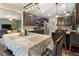 Open concept kitchen and dining area with dark wood cabinets, stainless appliances, and great natural light at 2605 Jacobean Rd, Acworth, GA 30101