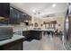 Spacious kitchen featuring dark wood cabinets, granite countertops, stainless steel appliances and an eat-in dining area at 2605 Jacobean Rd, Acworth, GA 30101