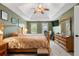 Spacious main bedroom featuring a tray ceiling, ample natural light, and a comfortable layout at 2605 Jacobean Rd, Acworth, GA 30101