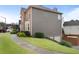 A brick and vinyl sided home with driveway leading to the attached two car garage at 2605 Jacobean Rd, Acworth, GA 30101