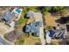 Stunning aerial view of a home with a spacious yard, long driveway, and beautiful landscaping at 4073 Hickory Fairway Dr, Woodstock, GA 30188