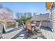 A spacious back deck is ready for relaxation with outdoor furniture and a scenic view at 4073 Hickory Fairway Dr, Woodstock, GA 30188