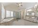 Luxurious bathroom featuring a soaking tub, glass enclosed shower, granite counters, and tiled floors at 4073 Hickory Fairway Dr, Woodstock, GA 30188