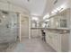Bright bathroom featuring a glass enclosed shower, tile flooring, granite countertops and double sinks at 4073 Hickory Fairway Dr, Woodstock, GA 30188