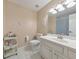 Bright bathroom with white marble floors, vanity, toilet, and shower/tub featuring neutral paint color at 4073 Hickory Fairway Dr, Woodstock, GA 30188