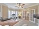 Bright bedroom with large bay windows, french doors, neutral walls and carpet, and recessed lighting at 4073 Hickory Fairway Dr, Woodstock, GA 30188